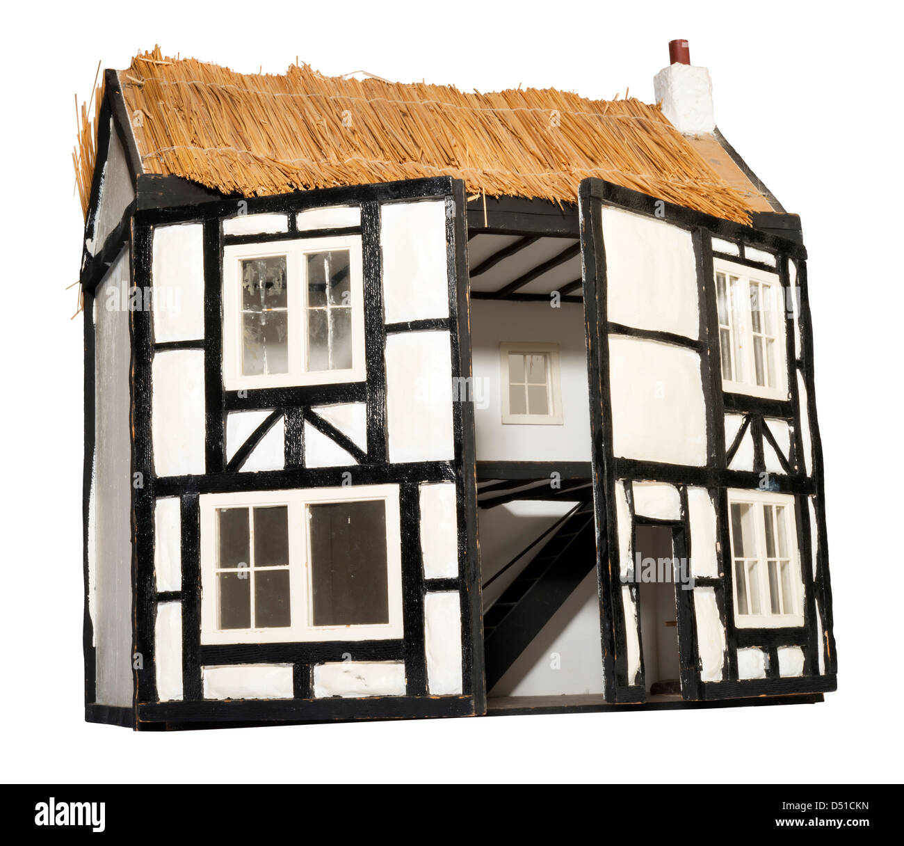 thatched roof dolls house Stock Photo