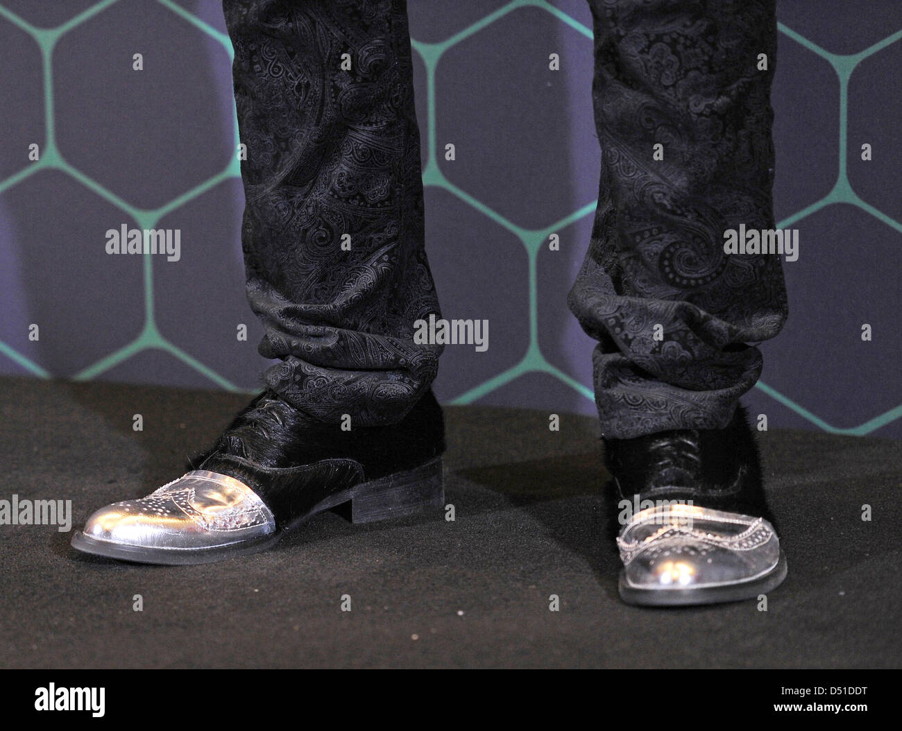 Taiwanese actor Jay Chou wears extravagant shoes for a promotional event for the film 'The Green Hornet' in Berlin, Germany, 03 December 2010. The film is an adaptation of a superhero comic and premieres in German cinemas on 13 January 2011. Photo: Jens Kalaene Stock Photo