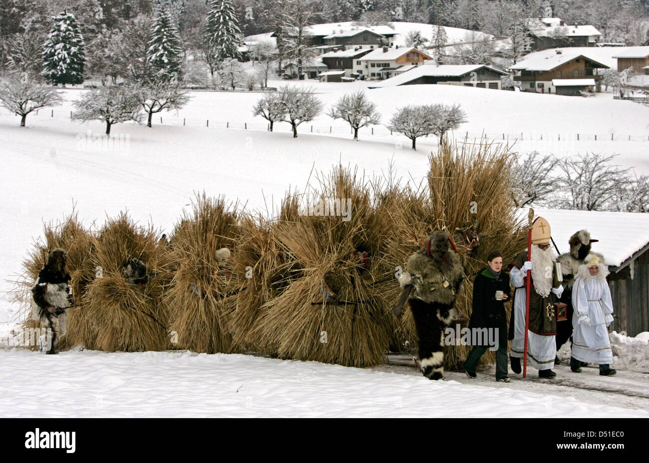 The Buttnmandl, men traditionally disguised in straw costumes, come