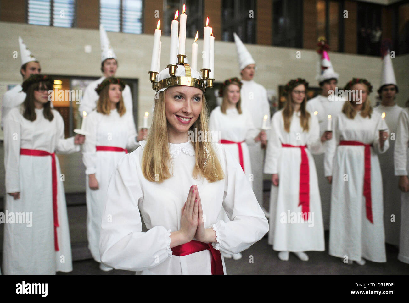 St Lucy and her entourage sing in the Foreign Office on initiative of Swedish Embassy to Germany in Berlin, Germany, 10 December 2010. Saint Lucy's Day is celebrated on 13 December in Sweden and commemorates the Syracuse patron who died in 303 AD. Photo: HANNIBAL Stock Photo