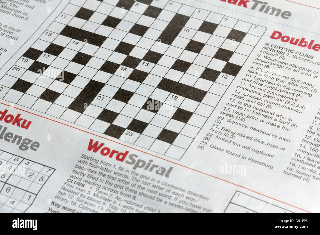 Crossword and puzzle page of the Bolton News, a local daily newspaper, published six days per week. Stock Photo