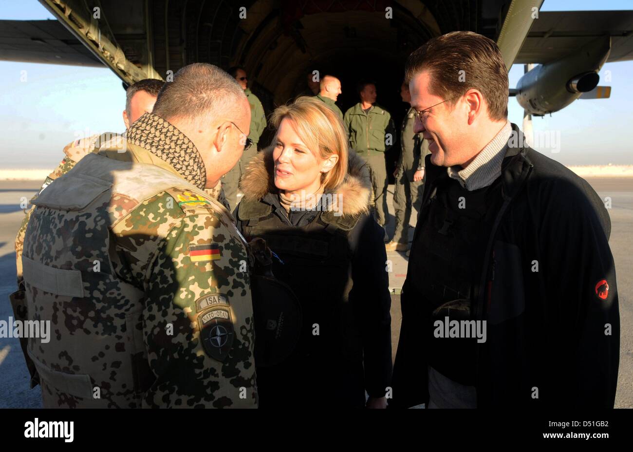 German Defence Minister Karl-Theodor zu Guttenberg (R) and his wife Stephanie talk to a soldierr in a military camp in Kunduz, Afghanistan, 13 December 2010. Guttenberg visits the German Bundeswehr soldiers of the ISAF mission contingent in Afghanistan. Photo: Maurizio Gambarini Stock Photo