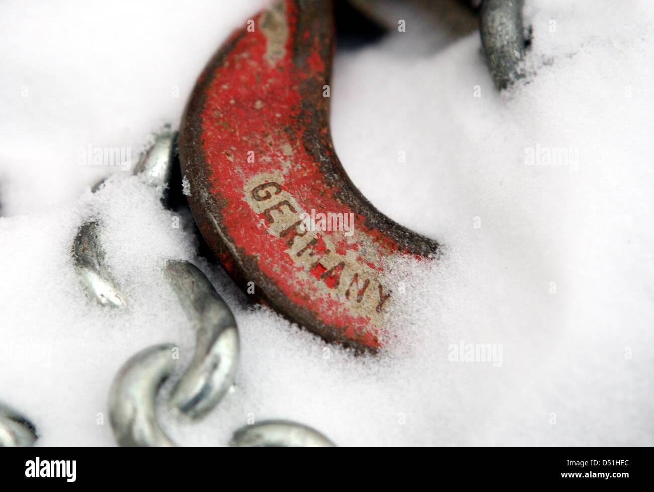 An iron chain and a carabiner with the lettering 'Germany' lies in the
