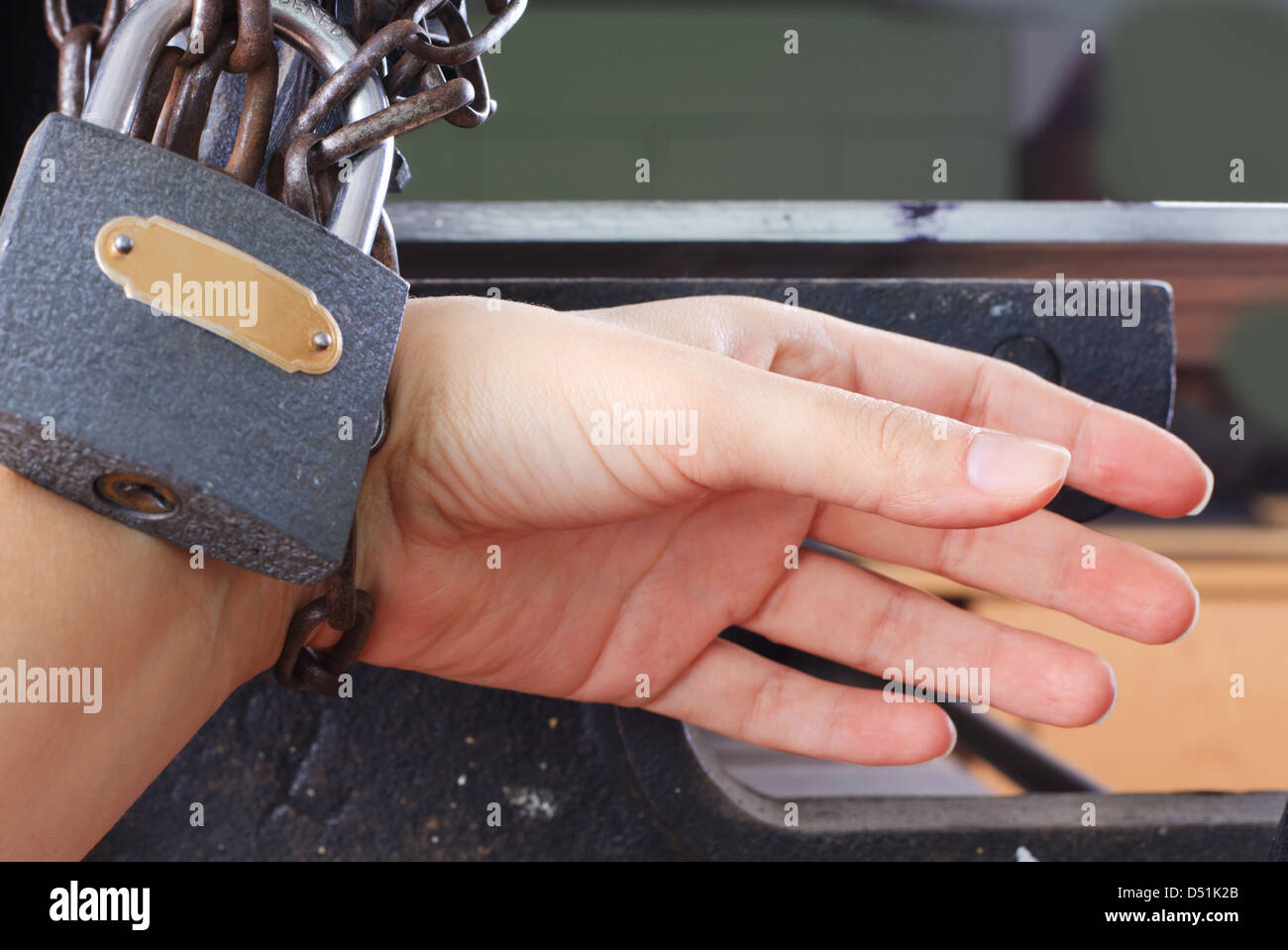 Hands with chain and lock Stock Photo