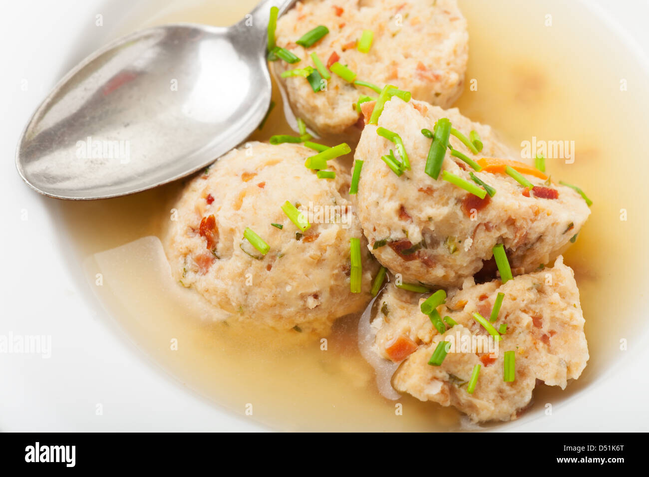speckknoedel, a tyrolean dumpling in broth Stock Photo