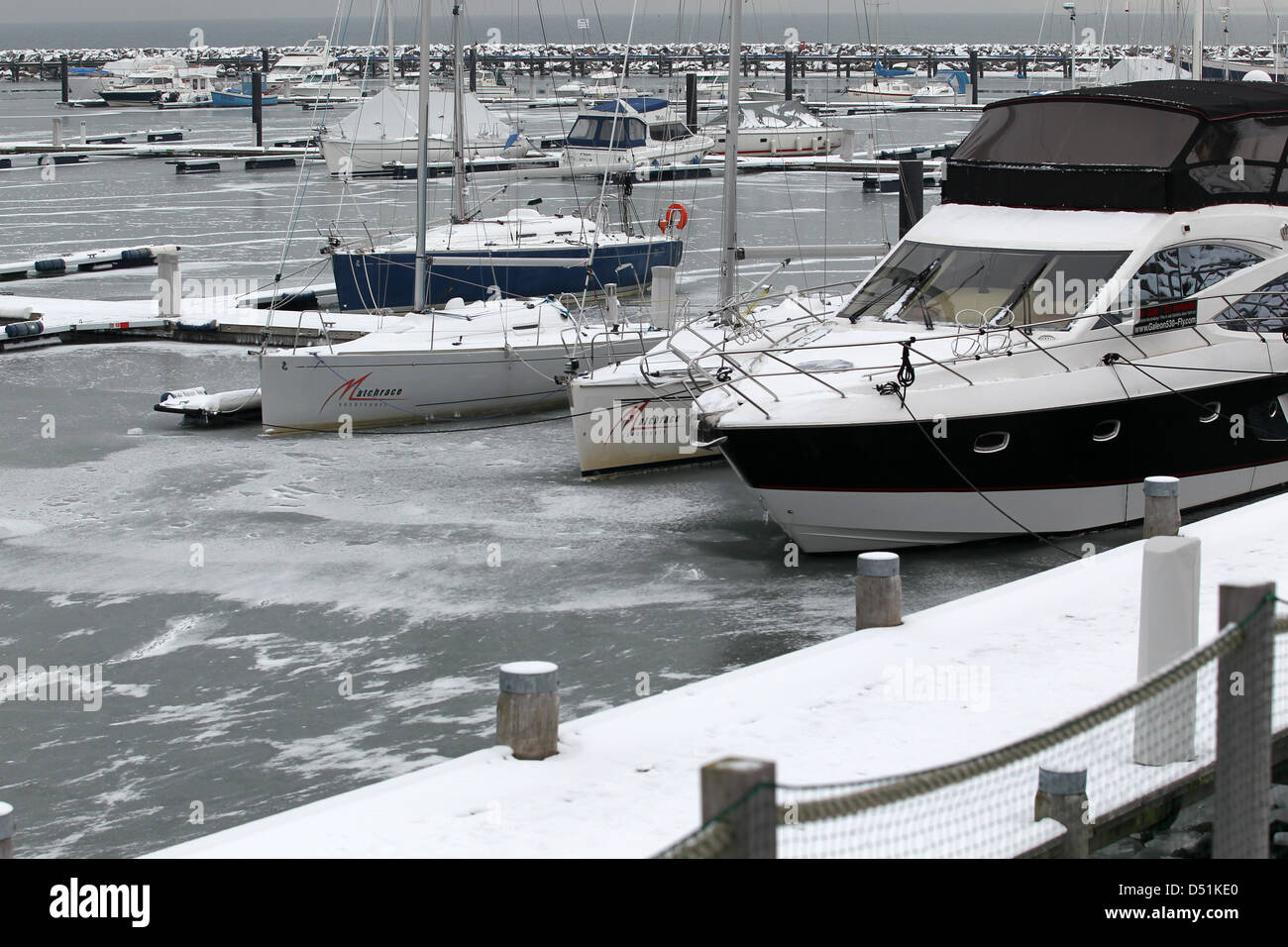 Boats are stuck in ice at the harbour of Kuehlungsborn at the Baltic