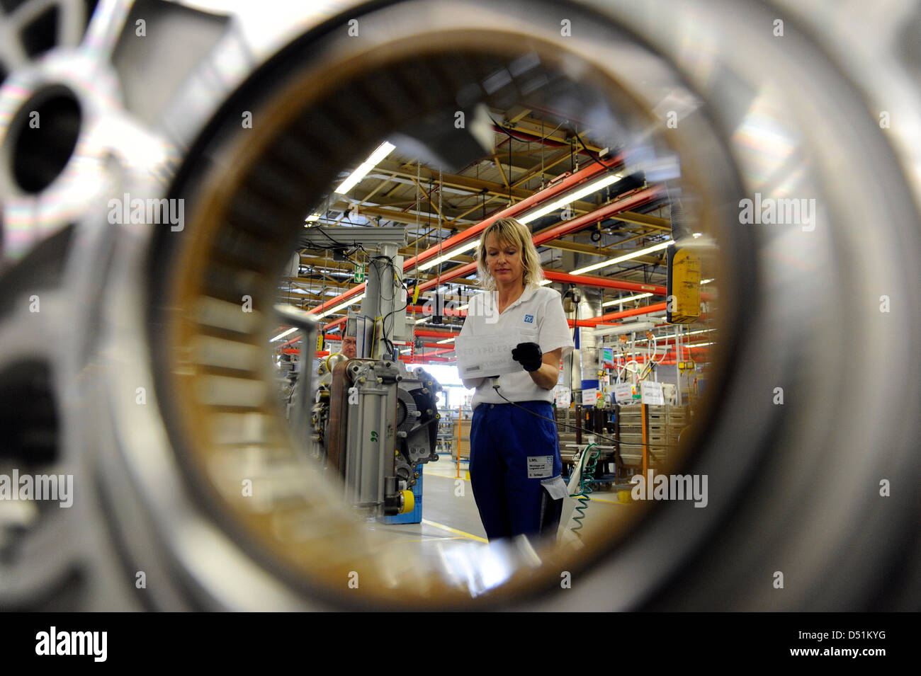 (FILE) An archive photo dated 22 May 2005 shows an employee of ZF on the assemlby belt at the factory in Friedrichshafen, Germany. According to a report by 'Bild' Newspaper on 22 December 2010, next year there will be an upturn in the economy. Photo: Patrick Seeger Stock Photo