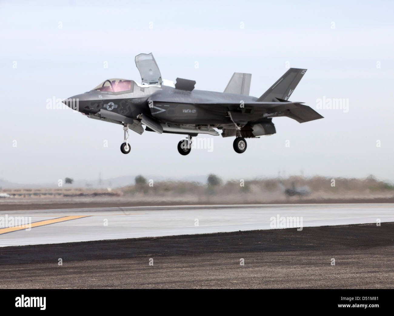 A US Marine Corps F-35B Lightning II stealth fighter aircraft makes the first operational short take off and vertical landing March 21, 2013 at Marine Corps Air Station Yuma, AZ. Stock Photo