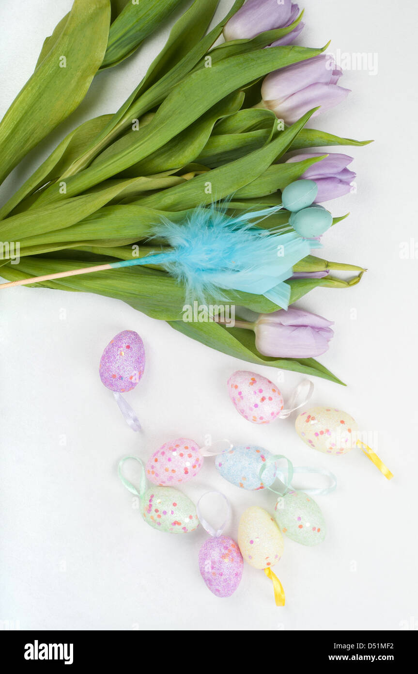 Easter eggs and tulip bouquet on light background Stock Photo - Alamy