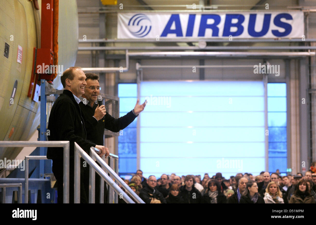 Employees of Airbus say goodbye to the completed fuselage for the fifth prototype of the Airbus A400M with director Kai Brueggemann (L) and head of fuselages Mario Heinen during a celebration at the plant in Bremen, Germany, 29 December 2010. With the fifth prototype, the development of the military plane is completed. Photo: Ingo Wagner Stock Photo