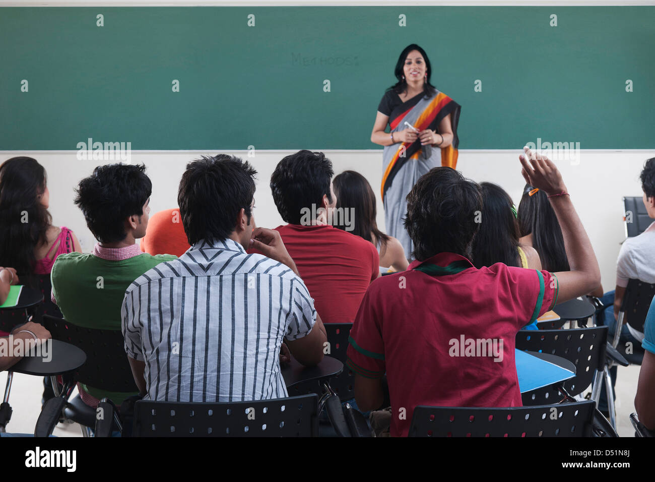 Female lecturer teaching in a classroom Stock Photo