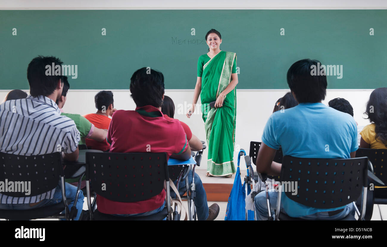 Female lecturer teaching in a classroom Stock Photo