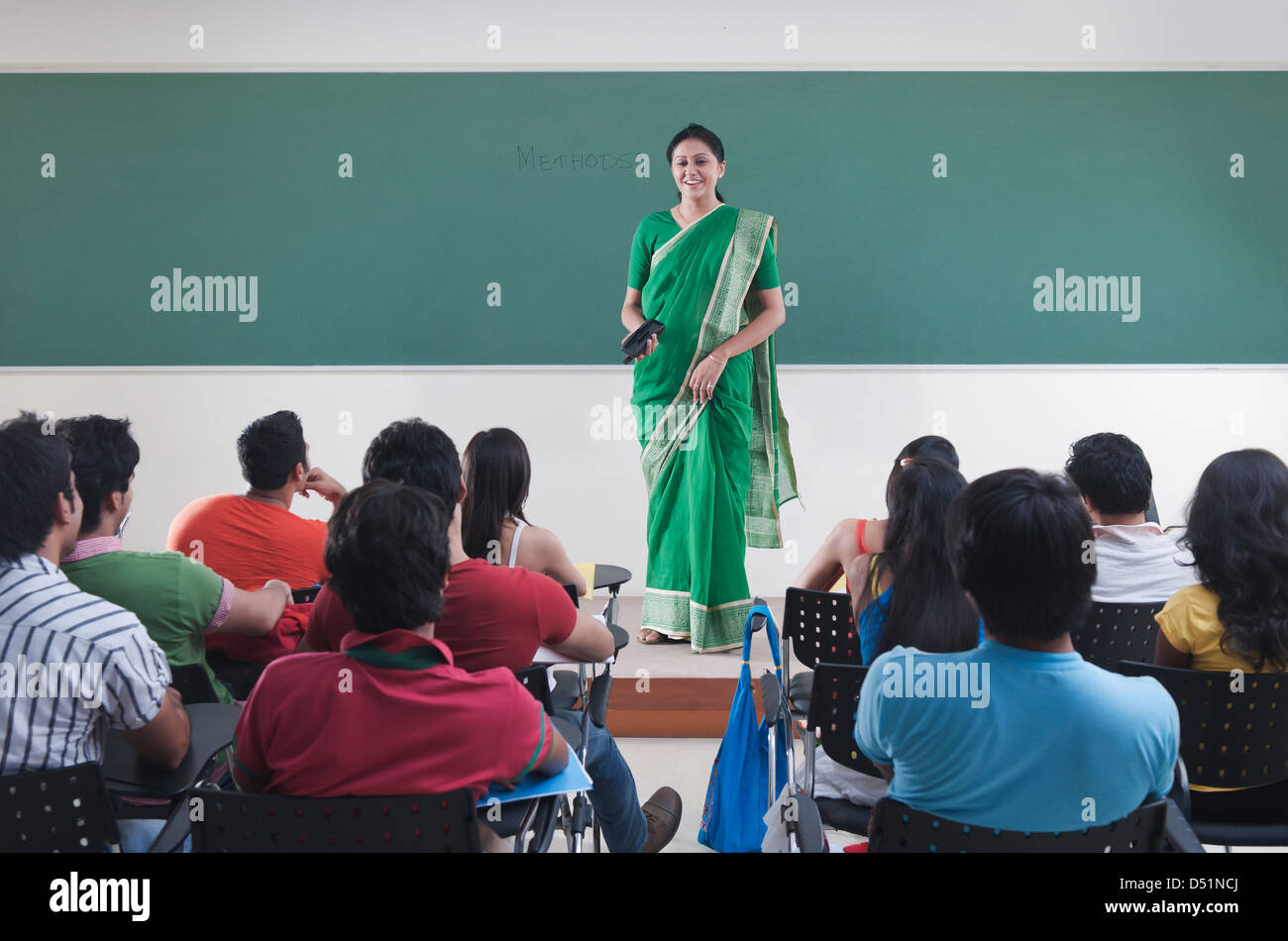 Female lecturer teaching in a classroom Stock Photo