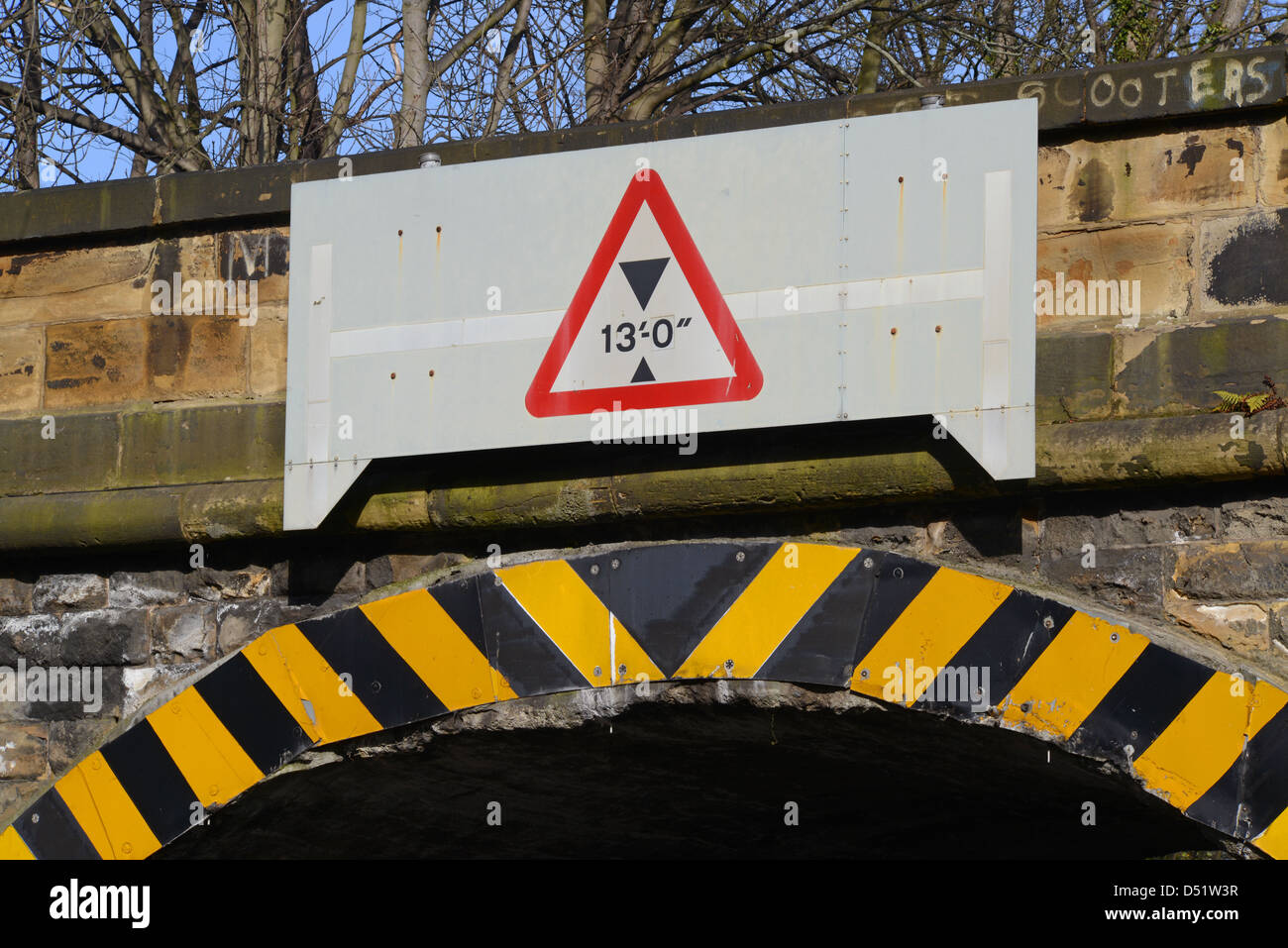 warning sign of low railway bridge over road Leeds Yorkshire UK Stock Photo