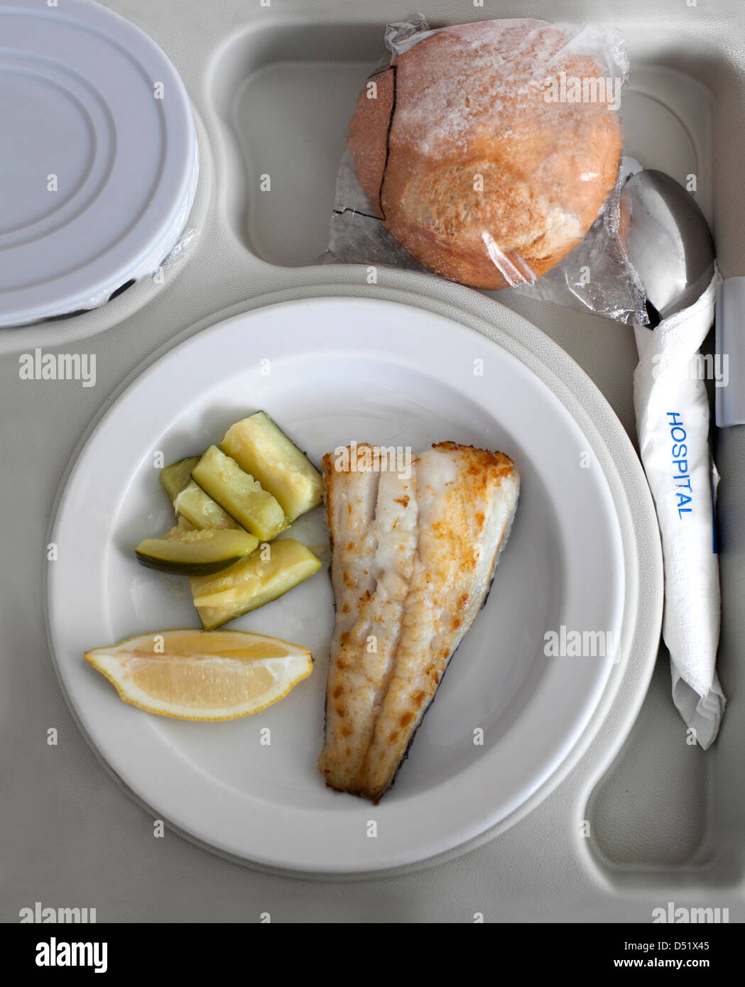 Fish and courgette served in a tray at a hospital Stock Photo - Alamy
