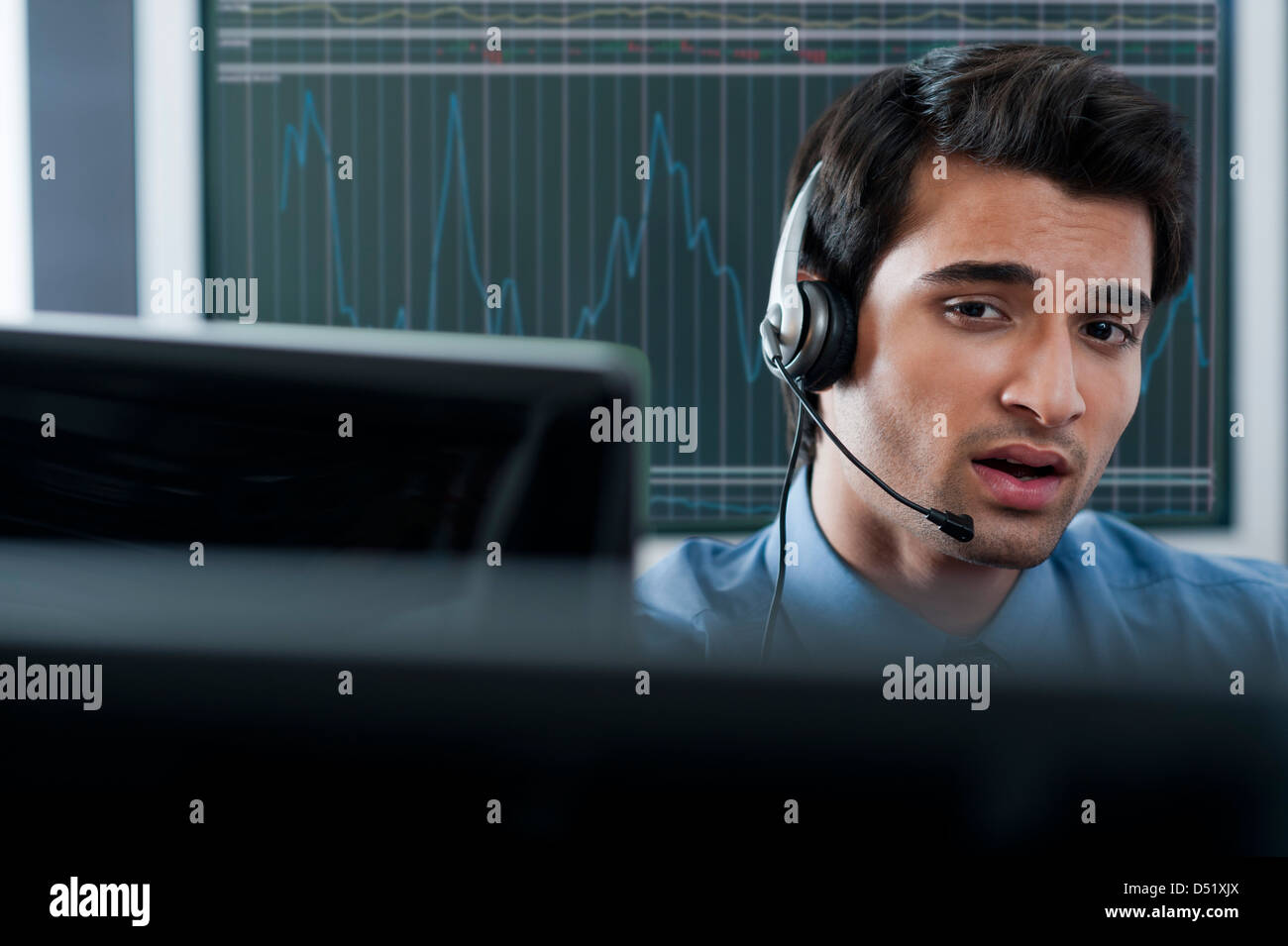Customer service representative wearing a headset Stock Photo - Alamy