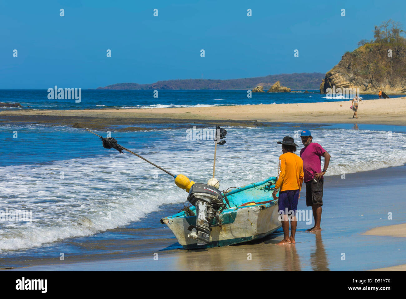 Fishermen with boat on beautiful Playa Pelada beach, Nosara, Guanacaste ...