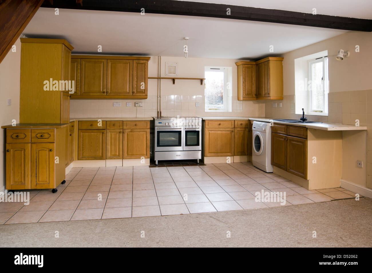 An empty kitchen in a vacant house. Stock Photo