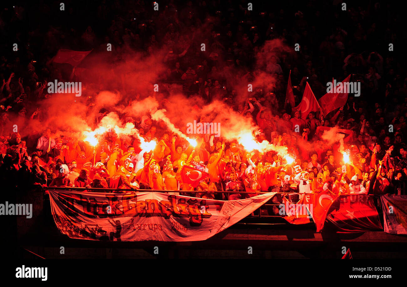 Turkish fans celebrate with flares during the UEFA Euro 2012 qualifier