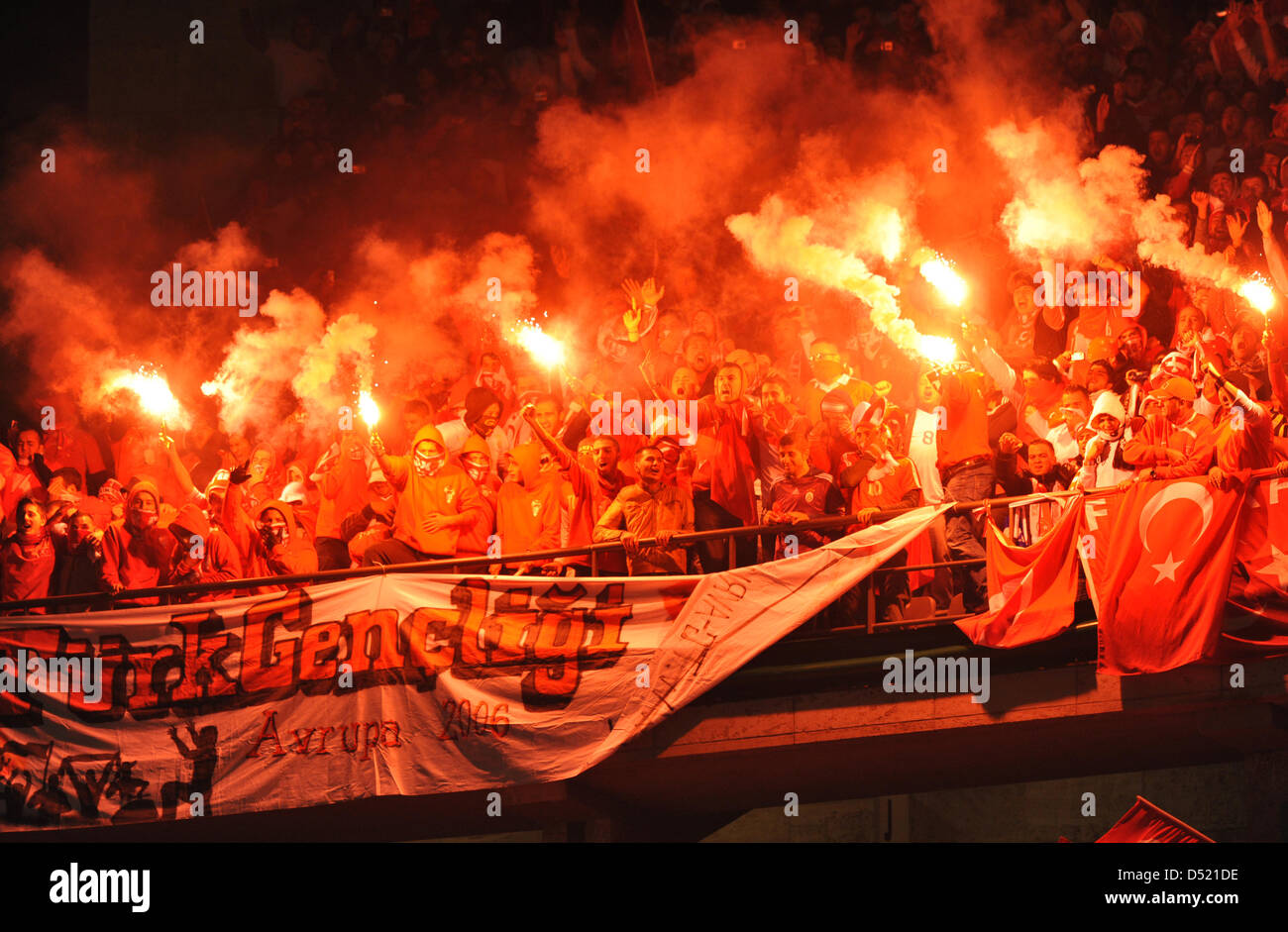 Turkish fans celebrate with flares during the UEFA Euro 2012 qualifier
