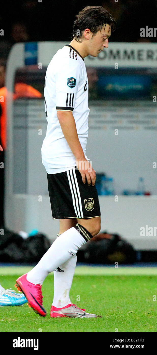 German player Mesut Oezil walks from the field after the 3-0 victory against Turkey of the UEFA Euro 2012 qualifier Germany vs Turkey at the Olympic Stadium in Berlin, Germany, 08 October 2010. Soccer player Oezil was injured during the match and will not be able to train during the weekend, due to a contusion. Photo: Wolfgang Kumm Stock Photo