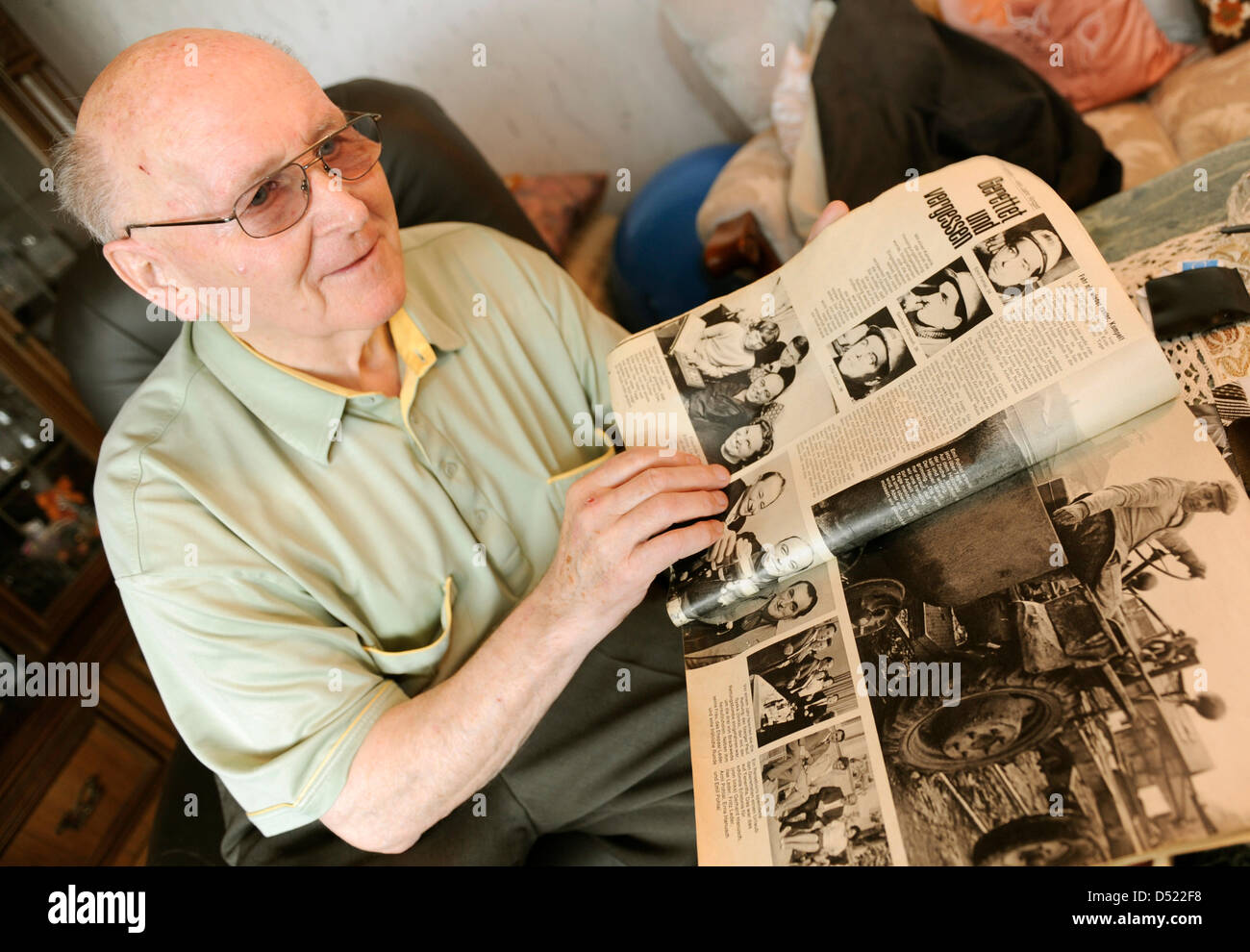 Siegfried Ebeling, a survivor of the mining drama of Lengede, examines historic newspaper articles in his apartment in Bodenstedt near Lengede, Germany, 12 October 2010. The 79 year-old was one of eleven miners that were trapped in an abandoned shaft for 14 days, before they were rescued on 3 November 1963. The rescue operation became widely know as the 'Miracle of Lengede'. Photo: Stock Photo