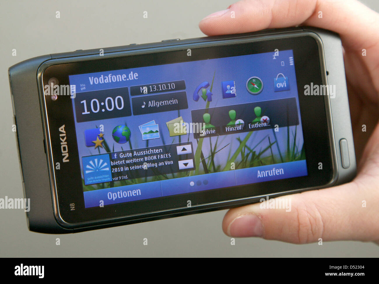 The new multimedia smartphone N8 of the company Nokia is presented in Berlin, Germany, 13 October 2010. With the new series of the model 'N', the market leader for mobile phones wishes to compete with Apple and Google. In competition with the iphone and Android, the last Nokia system Symbian seemed quite outmoded. Now, the N8 is the first smartphone with a new version of the mobile Stock Photo