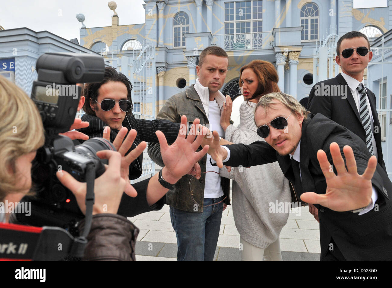 Look-alikes of actor Brad Pitt and actress Angelina Jolie, Samuel Brown and Dorien Rose Duinker, pose with their bodyguards at the Belantis amusement park in Leipzig, Germany, 14 October 2010. Dorien was playmate of the year 2004 and amazes together with Samuel fans of Angelina and Brad around the globe. Photo: Hendrik Schmidt Stock Photo