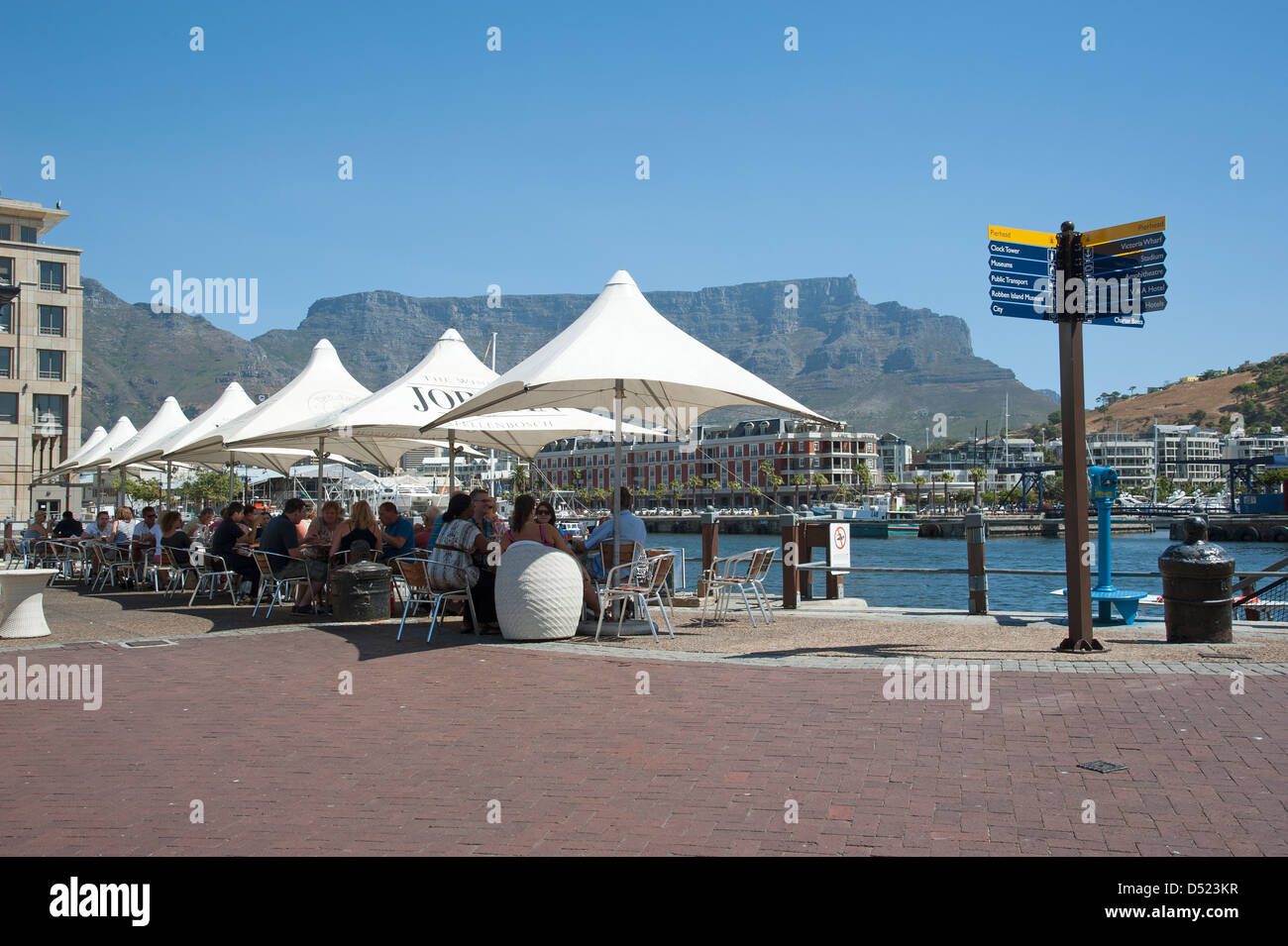 V&A Waterfront Cape Town & Table Mountain. Tourists at cafe tables