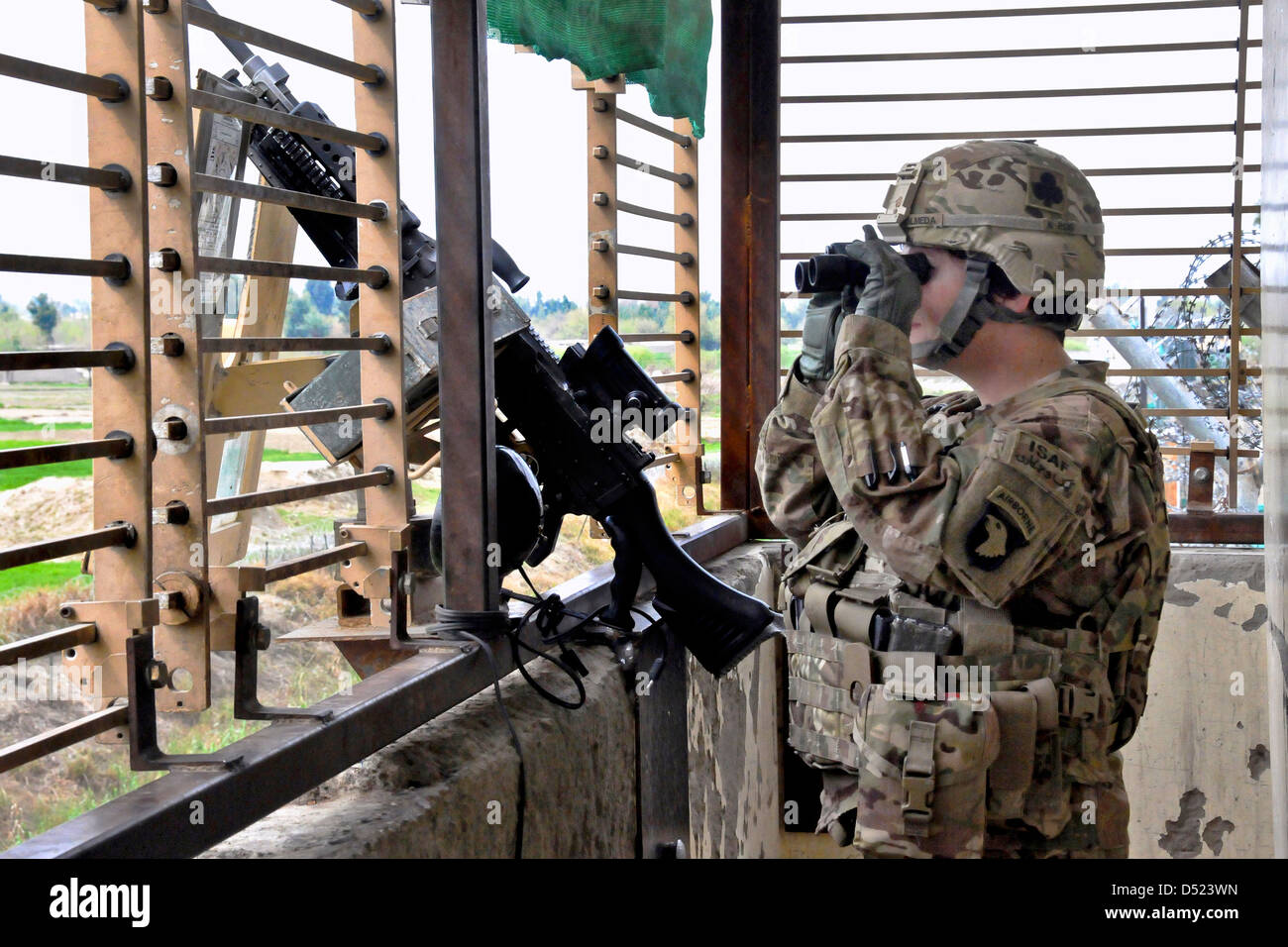 US Army Sgt. Amanda Olmeda provides security from an observation tower on Forward Operating Base Fenty March 13, 2013 in Afghanistan's Nangarhar province. Stock Photo