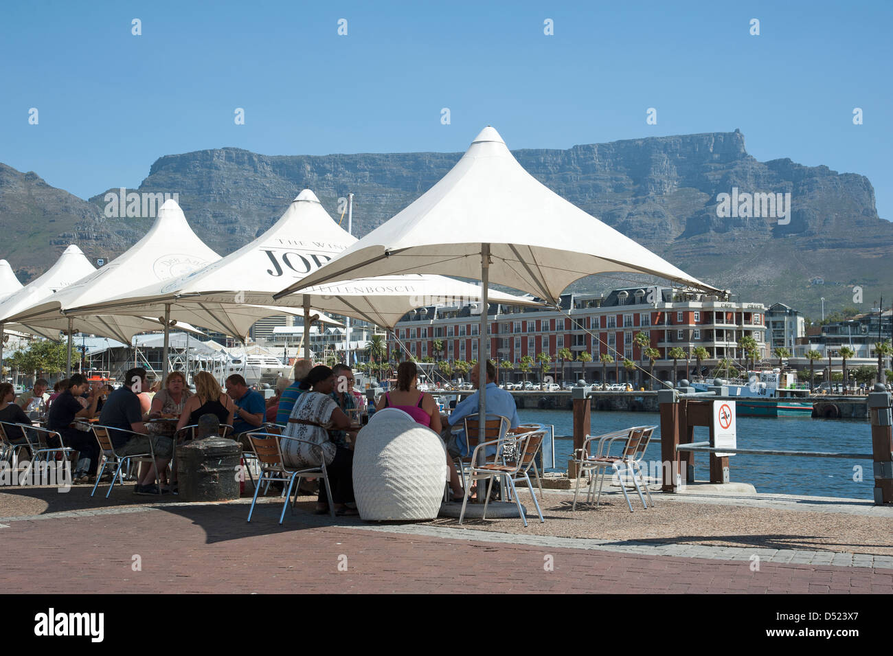V&A Waterfront Cape Town & Table Mountain. Tourists at cafe tables