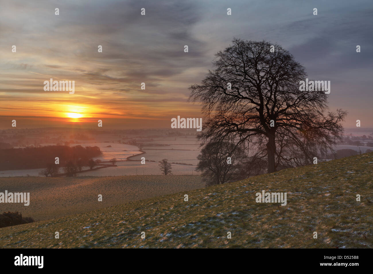 Beautiful Sunrise looking South across the Cheshire Plain from Peckforton. Stock Photo
