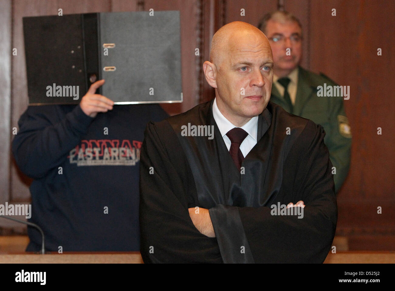 Defendant Patrick R. (L) is in the dock with his attourney Jochen Horn (R) at district court Nuremberg-Fuerth in Nuremberg, Germany, 19 October 2010. The 30-year-old is charged with joint murder and abuse of ward. He and his 27-year-old wife allegedly had neglected their three-year-old daughter Sarah from April to August 2009 to the point where she died from undernourishment on 10  Stock Photo