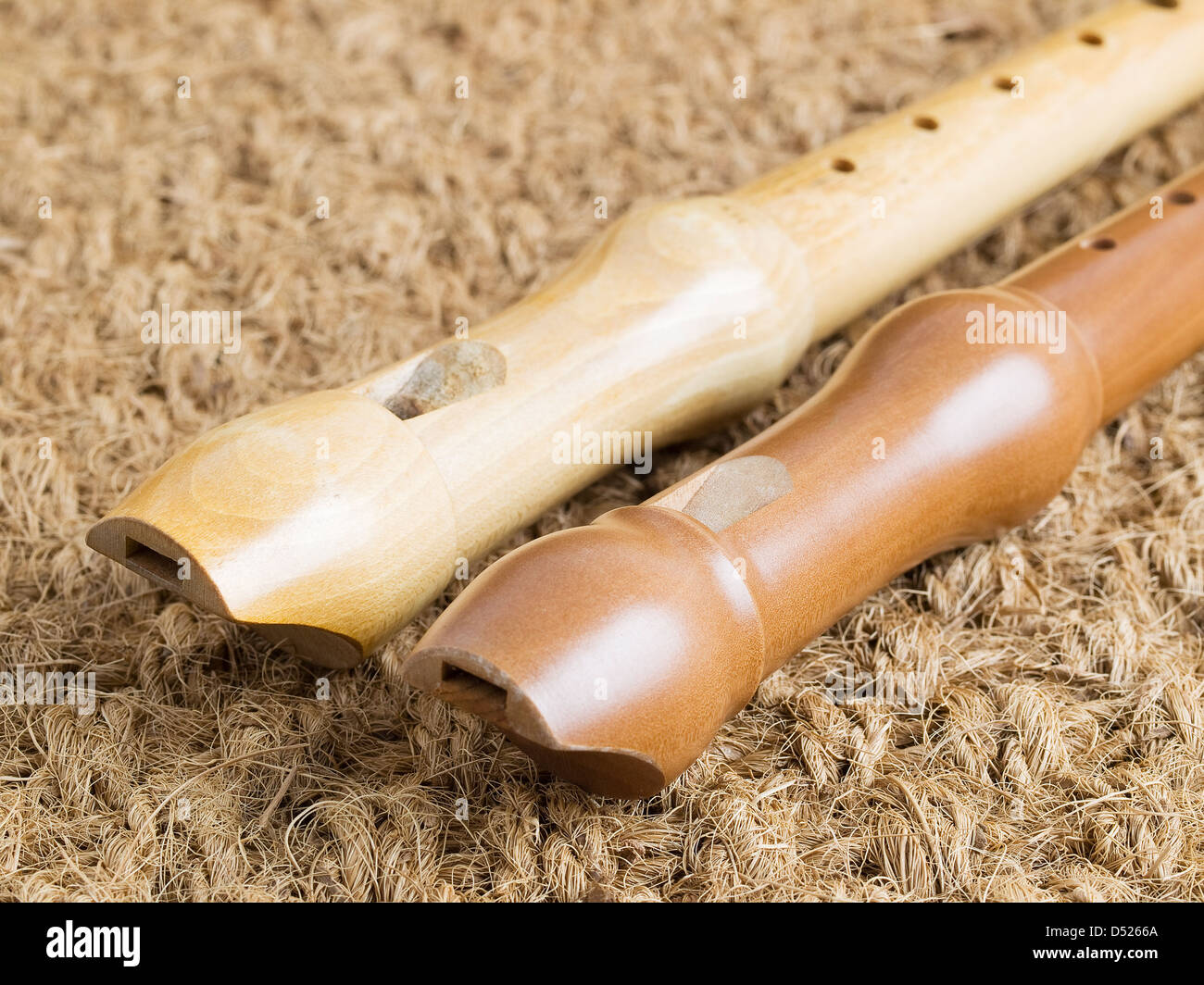 Two flutes on a straw background Stock Photo Alamy