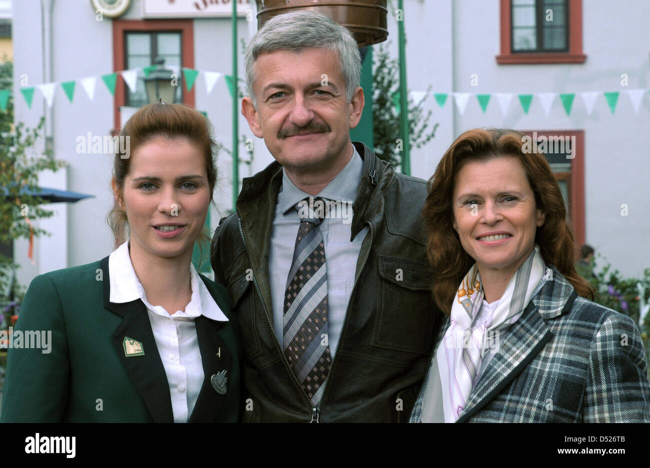 Actors and actresses Nora Tschirner (role: Meike Pelzer, L-R), Dominic Raacke (role: Father Pelzer) and Leslie Malton (role: Mother Pelzer) pose during the shooting of the movie 'Offroad' in Geilenkirchen, Germany, 16 October 2010. The plot of the movie is about the thrilling search for the sense and senselessness of life, as well as an unexpected love. Photo: Horst Ossinger Stock Photo