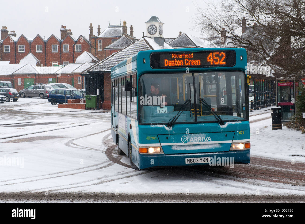 Arriva bus leaves Sevenoaks bus station during falling snow. The vehicle is a Dennis Dart SLF 8.8m Plaxton Pointer 2 Stock Photo