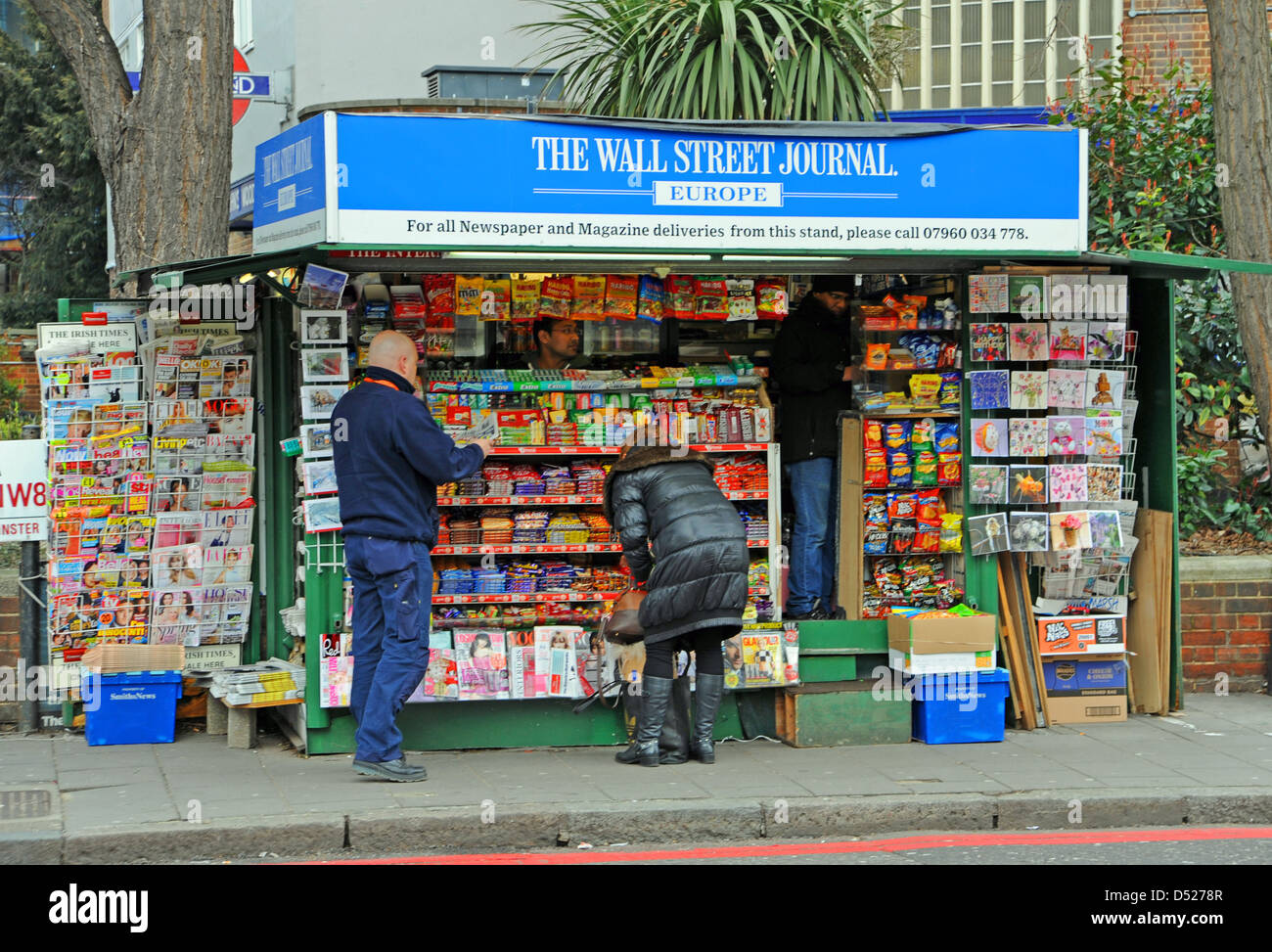 newspaper stand selling the Wall Street Journal at the St John's Wood Underground train station in London UK Stock Photo