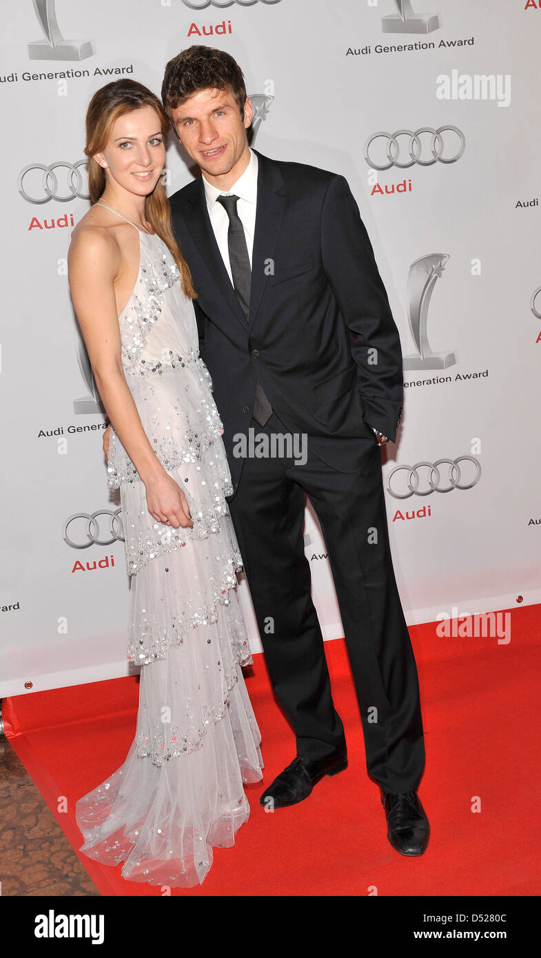 Soccer professional Thomas Mueller of FC Bayern and his wife Lisa pose