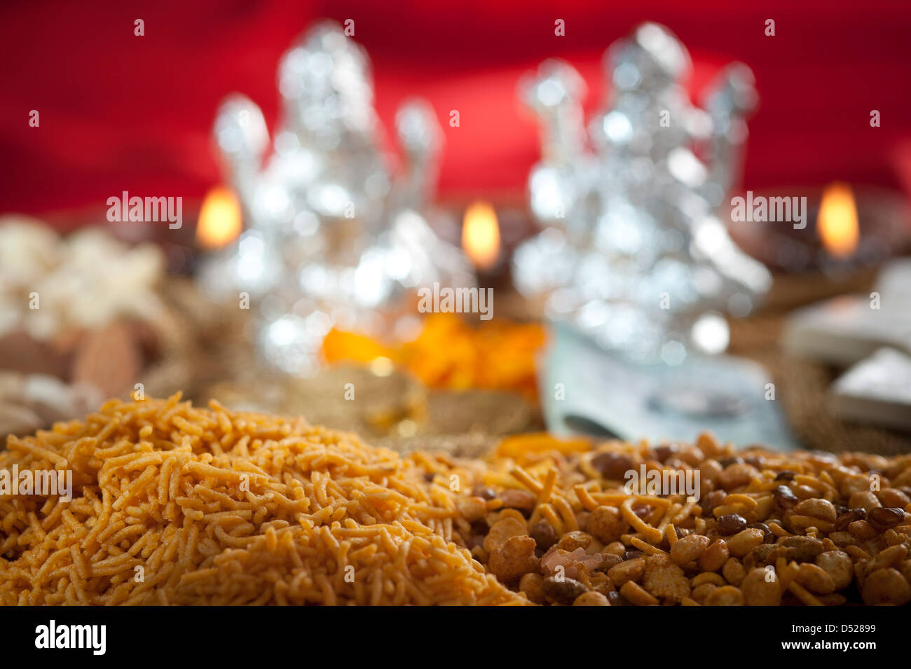Snacks with idols of Lakshmi and Ganesh during Diwali festival Stock Photo