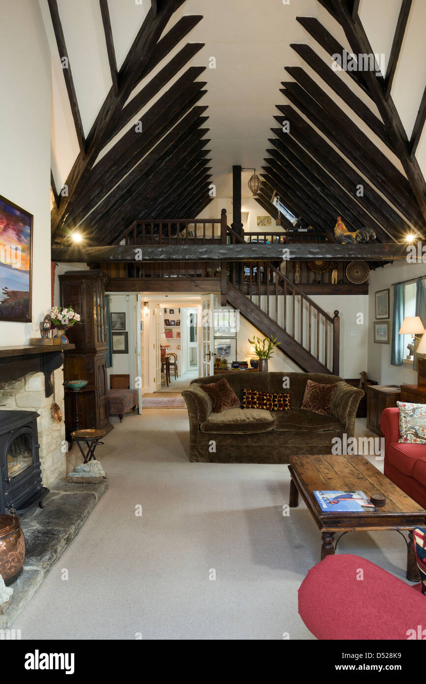 A Sitting Room With Double Height Ceiling Period Beams And A