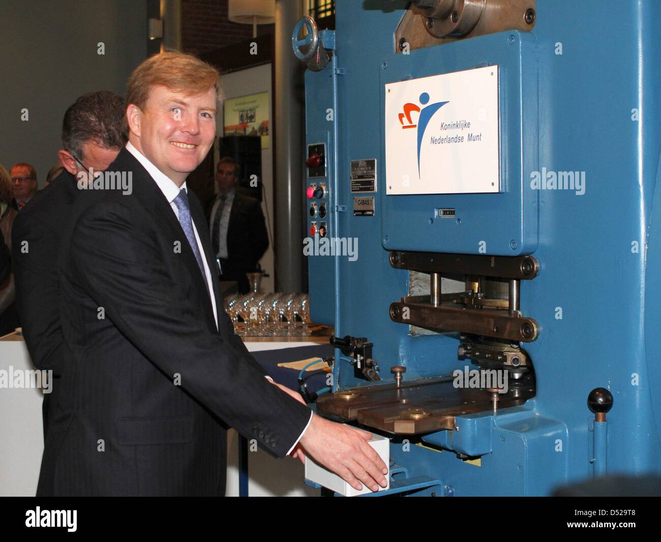 Dutch Crown Prince Willem-Alexander attends the minting of the first waterland 5-euro-coin at the Royal Dutch Mint in Utrecht, The Netherlands, 28 October 2010. The coin shows the separation between high and low water of The Netherlands. Photo: Albert Nieboer Stock Photo