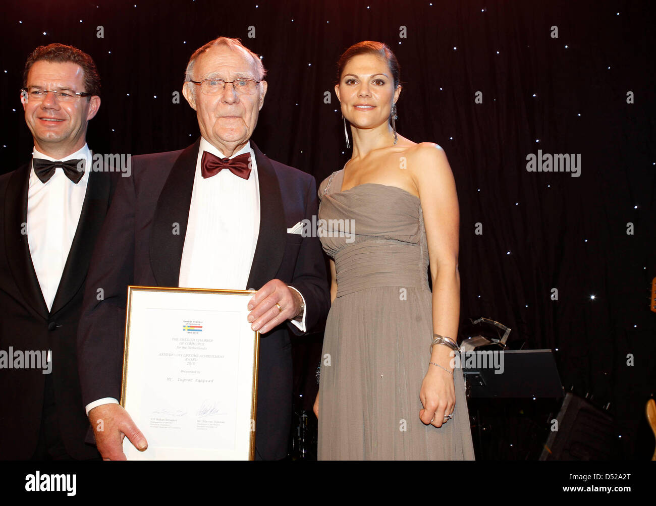 Crown Princess Victoria of Sweden (R) hands over The Swedish Chamber of Commerce Lifetime Achievement Award to 77-year-old founder of IKEA, Ingvar Kamprad (C) during the gala dinner on the 50th anniversary of the Swedish Chamber of Commerce in Noordwijk, the Netherlands, 28 October 2010. Photo:Reni van Maren/Pool ( NETHERLANDS OUT) Stock Photo