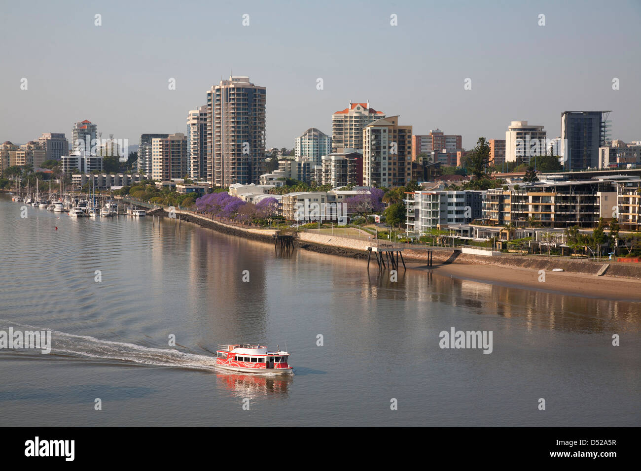 Brisbane City River ferry passing the residential apartment buildings