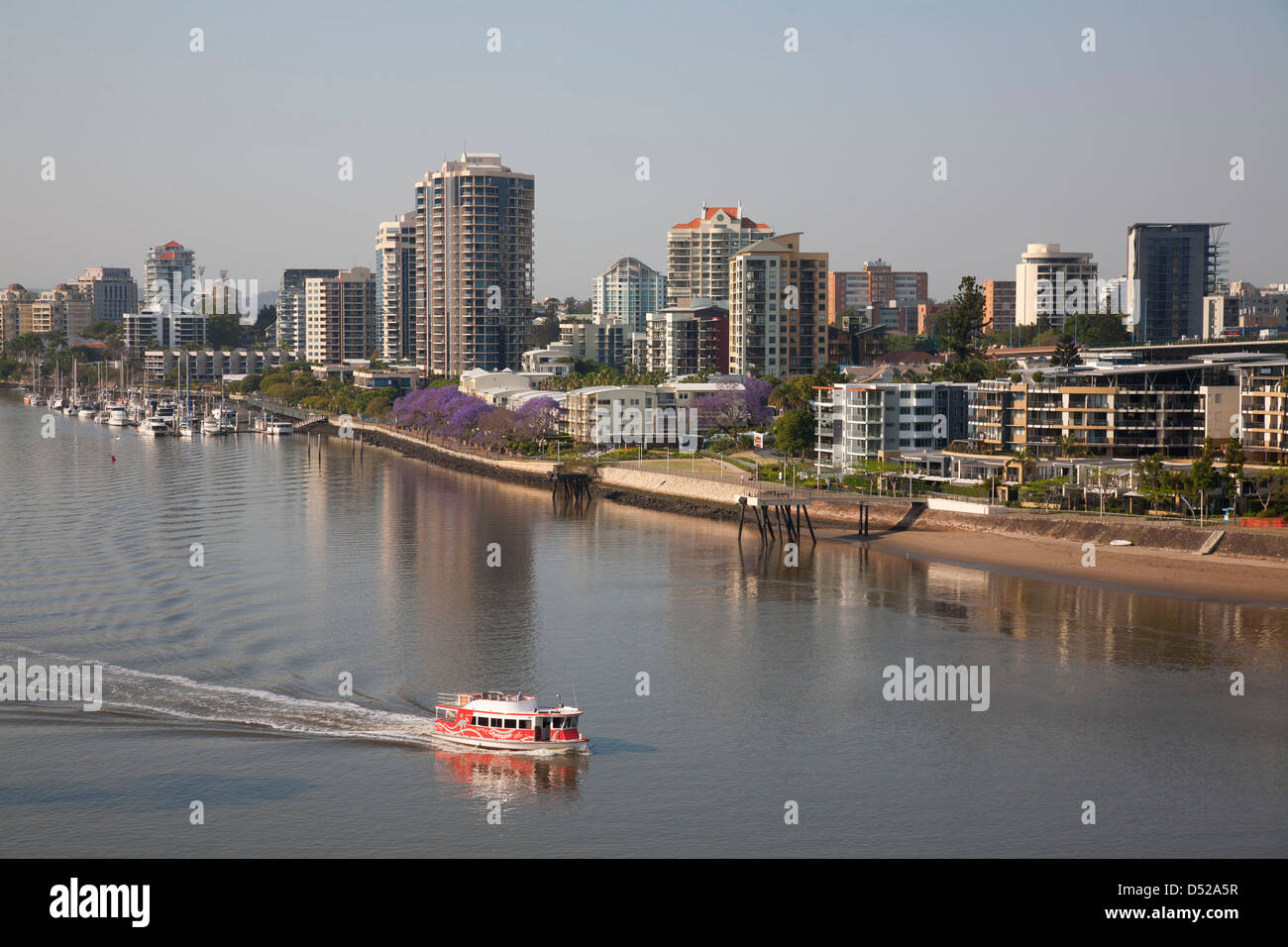 Brisbane City River ferry passing the residential apartment buildings on Kangaroo Point Brisbane Queensland Australia Stock Photo