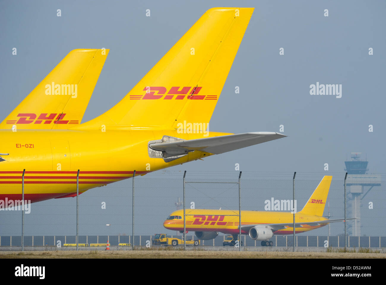 DHL-cargo planes are situated at the airport in Leipzig/Halle, Germany, 31 October 2010. Two coincidentally thwarted bomb attacks, implemented with air mail parcels to the USA, have alerted counter-terrorism officials. After a request of the US Transportation Security Administration (TSA) and with permission of the German Ministry of Transport, DHL searched the cargo from Yemen in  Stock Photo