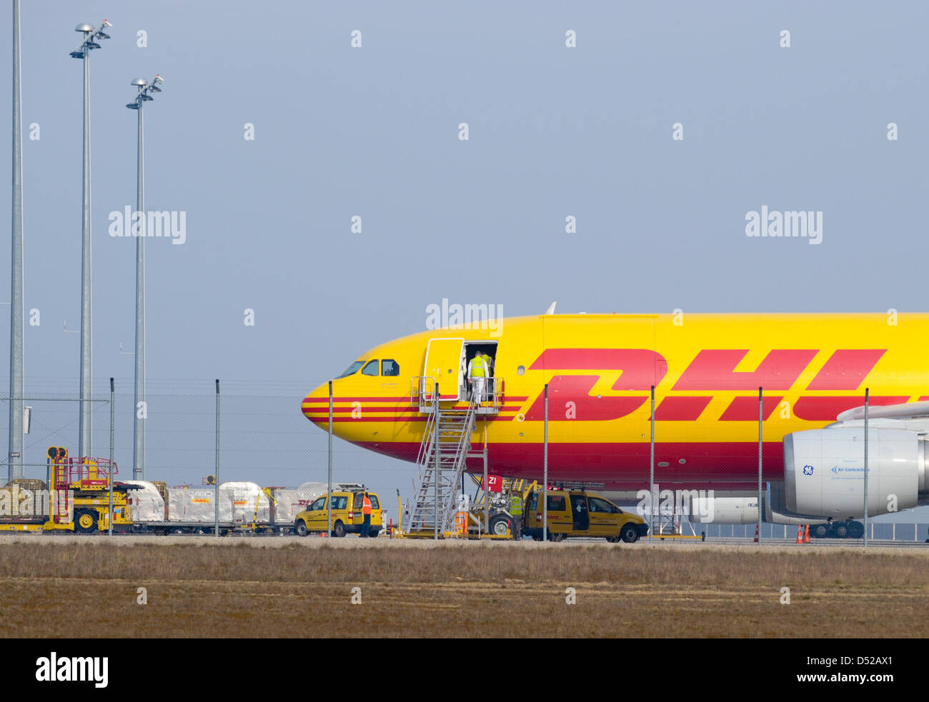 DHL-cargo planes are situated at the airport in Leipzig/Halle, Germany, 31 October 2010. Two coincidentally thwarted bomb attacks, implemented with air mail parcels to the USA, have alerted counter-terrorism officials. After a request of the US Transportation Security Administration (TSA) and with permission of the German Ministry of Transport, DHL searched the cargo from Yemen in  Stock Photo