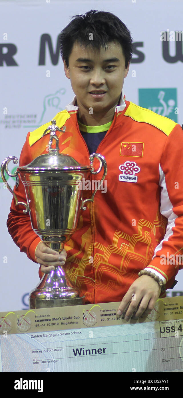 World Table Tennis Champion Wang Hao presents his prize trophy of the