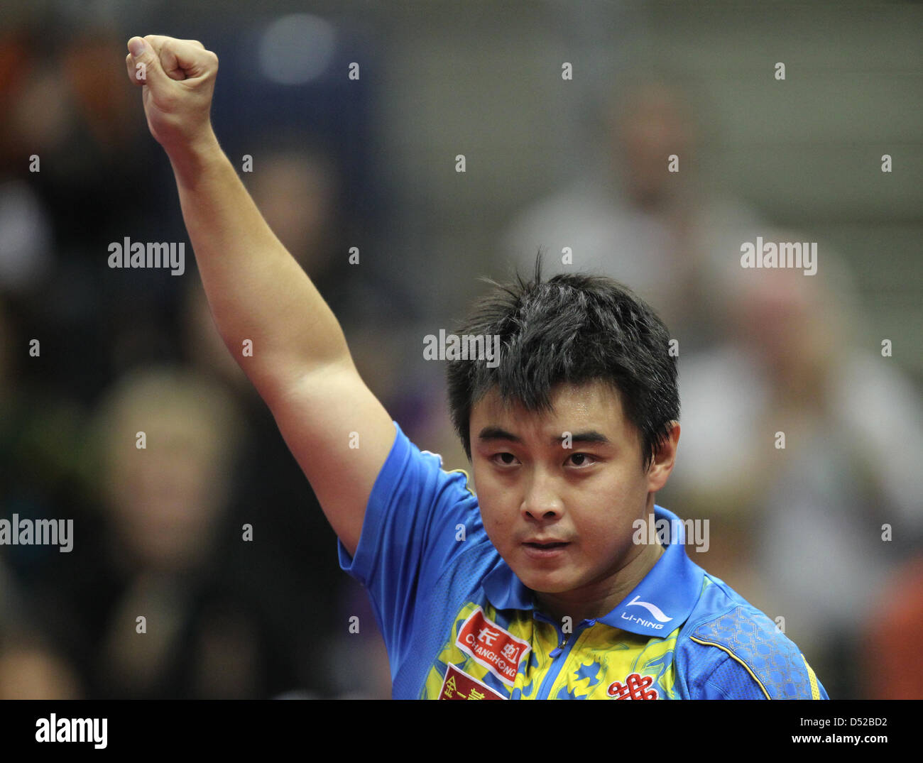 Chinese table tennis world champion Wang Hao cheers during the finale