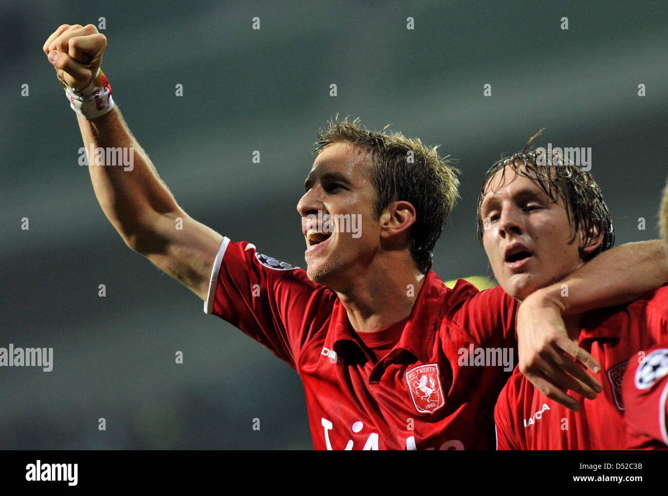 Enschede's Marc Janko (R) and Luuk de Jong cheer after Jong's goal for his team during the Champions League group A match between Werder Bremen and FC Twente Enschede at the Weserstadion in Bremen, Germany 02 November 2010. Photo: Jochen Lübke Stock Photo