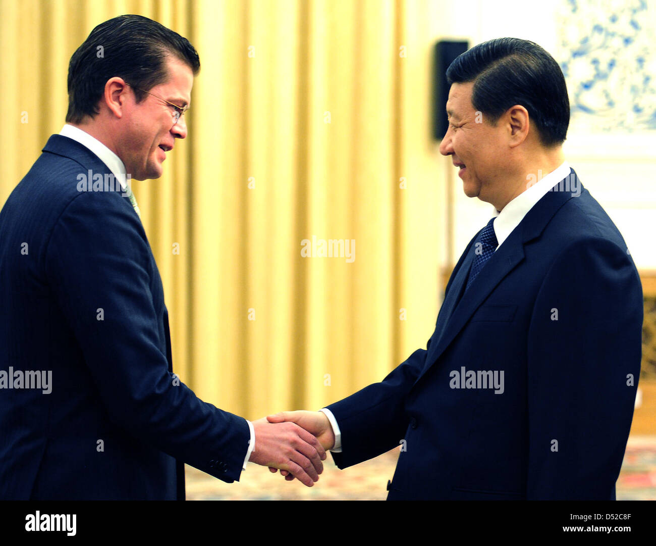 German Mininster of Defence Karl-Theodor zu Guttenberg is greeted by Chinese Vice-President Xi Jinping (R) in Beijing, China, 03 November 2010. The political meetings in Beijing deal among other with topics concerning military co-operations between China and Germany, the new NATO strategy for military operations in Afghanistan and the fight against piracy. Photo: Hannibal Stock Photo